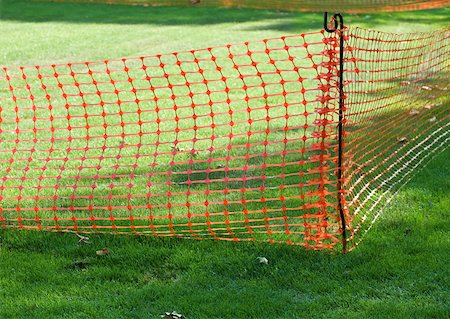 simsearch:6118-09059537,k - Plastic mesh fence on grass Stock Photo - Premium Royalty-Free, Code: 633-01272636