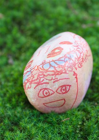 draw close up face - Stone decorated with face, lying on ground Stock Photo - Premium Royalty-Free, Code: 633-01272696