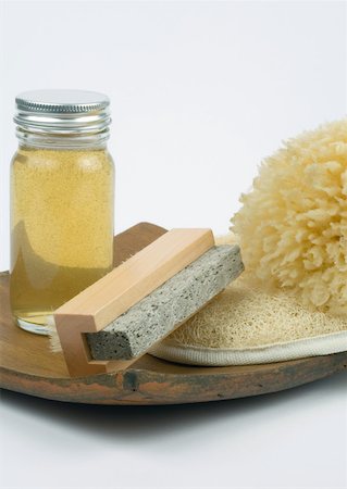 simsearch:633-01272935,k - Grooming products, pumice stone, body oil, loofah and sponge on wooden tray Stock Photo - Premium Royalty-Free, Code: 633-01272935