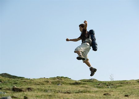 Hiker jumping Stock Photo - Premium Royalty-Free, Code: 633-01273150