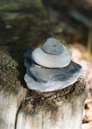 Stack of stones on stump Stock Photo - Premium Royalty-Free, Code: 633-01273360