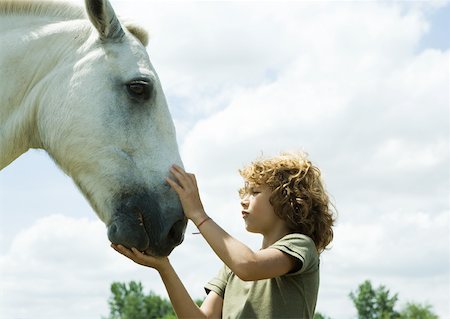 simsearch:633-01272720,k - Boy petting horse Stock Photo - Premium Royalty-Free, Code: 633-01273387