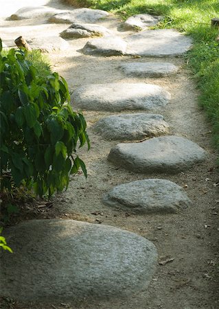 Stepping stones in pathway Stock Photo - Premium Royalty-Free, Code: 633-01273887
