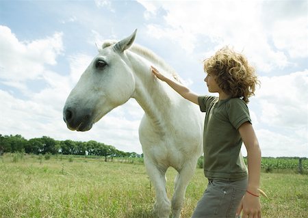 simsearch:633-01272720,k - Boy petting horse Stock Photo - Premium Royalty-Free, Code: 633-01273894