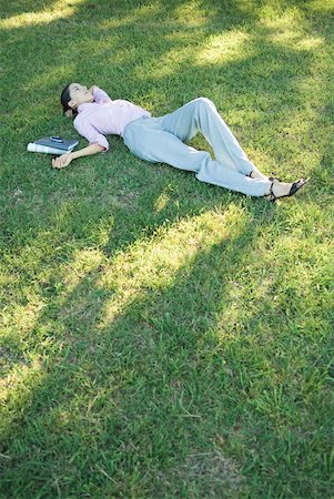 simsearch:633-01574322,k - Businesswoman lying in grass Stock Photo - Premium Royalty-Free, Code: 633-01574288