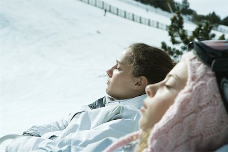 simsearch:6126-08635074,k - Two teen girls reclining in snow Stock Photo - Premium Royalty-Free, Code: 633-01574573