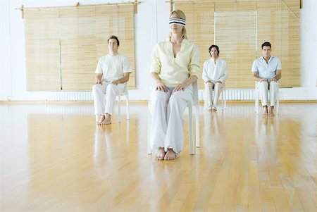 Group therapy, woman in foreground blindfolded Stock Photo - Premium Royalty-Free, Code: 633-01574648