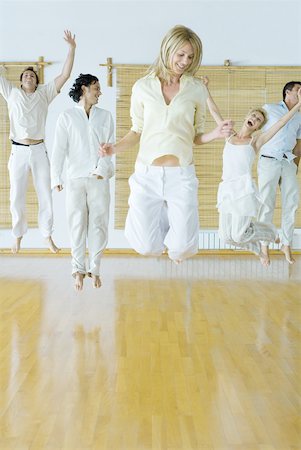relieved excited person - Group therapy, four adults jumping in the air Stock Photo - Premium Royalty-Free, Code: 633-01574656