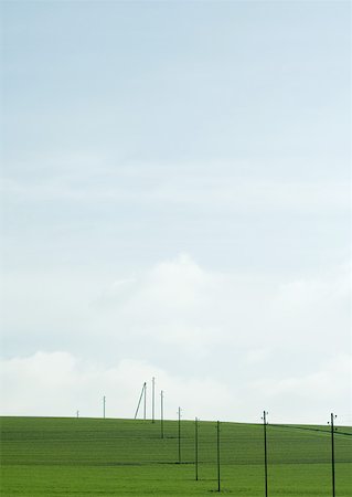 simsearch:633-01273732,k - Line of electric posts in green field Stock Photo - Premium Royalty-Free, Code: 633-01572454