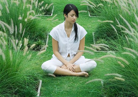 simsearch:633-01572611,k - Woman sitting on grass, indian style, eyes closed Stock Photo - Premium Royalty-Free, Code: 633-01572558