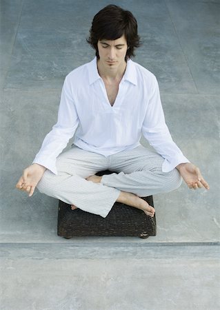 Man sitting in lotus position Stock Photo - Premium Royalty-Free, Code: 633-01572594