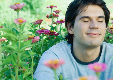 simsearch:633-01572611,k - Man sitting in flowers, eyes closed Stock Photo - Premium Royalty-Free, Code: 633-01572725