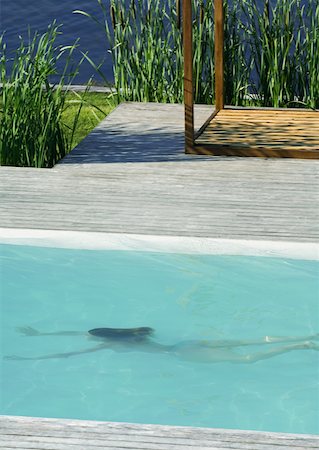 retenir son souffle - Femme nager sous l'eau dans la piscine, pleine longueur, vue grand angle Photographie de stock - Premium Libres de Droits, Code: 633-01572900