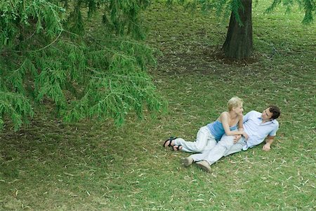 people laying on the floor top view - Couple lying in grass, smiling at each other, full length, high angle view Stock Photo - Premium Royalty-Free, Code: 633-01573114