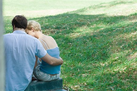 Couple sitting outdoors, rear view Stock Photo - Premium Royalty-Free, Code: 633-01573110