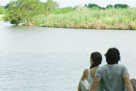 simsearch:696-03402108,k - Couple sitting by lake, rear view Stock Photo - Premium Royalty-Free, Code: 633-01573142