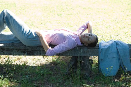 simsearch:633-01574322,k - Businesswoman lying on bench, outdoors, eyes closed Stock Photo - Premium Royalty-Free, Code: 633-01573536