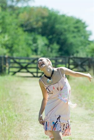 simsearch:633-01837186,k - Young woman running on rural path with head back, eyes closed Stock Photo - Premium Royalty-Free, Code: 633-01714198