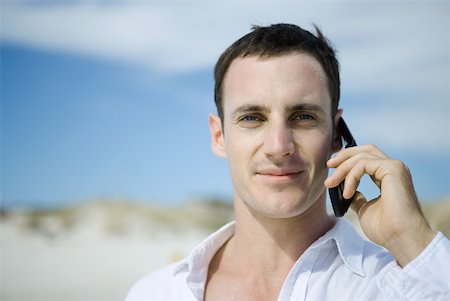 person standing mobile beach - Man using cell phone, dunes in background, portrait Stock Photo - Premium Royalty-Free, Code: 633-01714447
