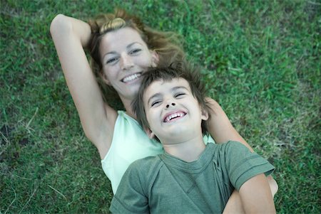 simsearch:633-05401631,k - Boy and mother, boy lying on top of woman, on grass, high angle view Stock Photo - Premium Royalty-Free, Code: 633-01714829