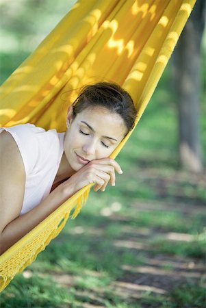 simsearch:633-01572611,k - Woman resting in hammock, eyes closed Stock Photo - Premium Royalty-Free, Code: 633-01714901