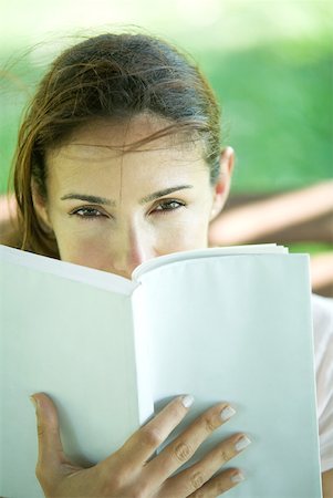 simsearch:695-03377942,k - Woman looking over book Stock Photo - Premium Royalty-Free, Code: 633-01714915