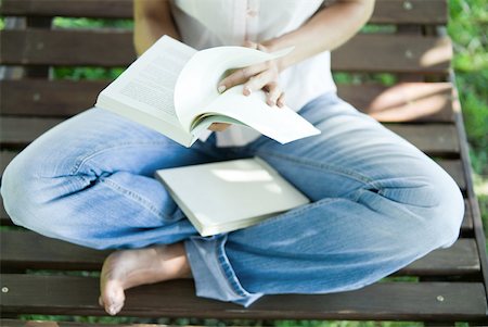 reading on park bench - Woman sitting barefoot on bench, reading book Stock Photo - Premium Royalty-Free, Code: 633-01714913
