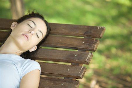 simsearch:633-01572611,k - Woman sleeping on bench, cropped Stock Photo - Premium Royalty-Free, Code: 633-01714933