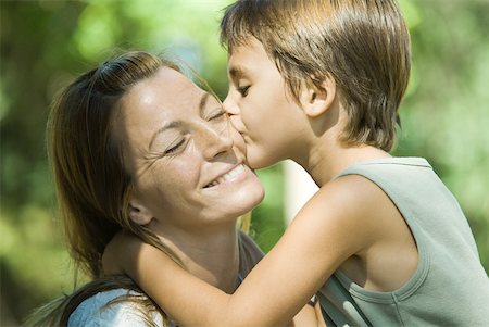 simsearch:632-02416107,k - Mother and son, boy kissing woman on cheek, close-up Stock Photo - Premium Royalty-Free, Code: 633-01714967