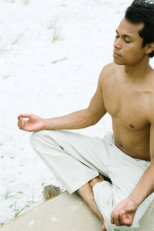 simsearch:633-01572611,k - Barechested man sitting in lotus position, eyes closed, cropped Stock Photo - Premium Royalty-Free, Code: 633-01715162