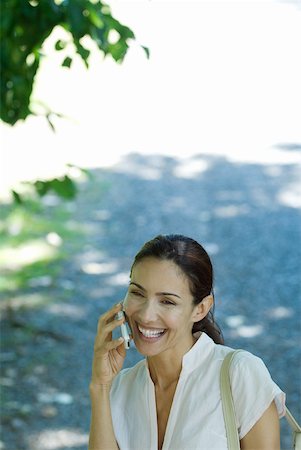 simsearch:633-01574322,k - Woman using cell phone outdoors, high angle view Stock Photo - Premium Royalty-Free, Code: 633-01715284