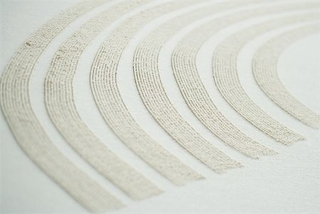 simsearch:670-06450558,k - Curve pattern traced in sand, close-up Stock Photo - Premium Royalty-Free, Code: 633-01715482
