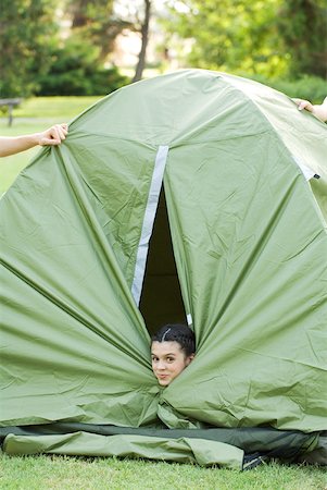 simsearch:633-01714076,k - Young camper peeking head out of tent Stock Photo - Premium Royalty-Free, Code: 633-01715603