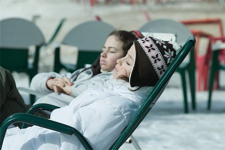 simsearch:6126-08635074,k - Teen girl sitting in chairs at ski resort, relaxing in sun Stock Photo - Premium Royalty-Free, Code: 633-01713727