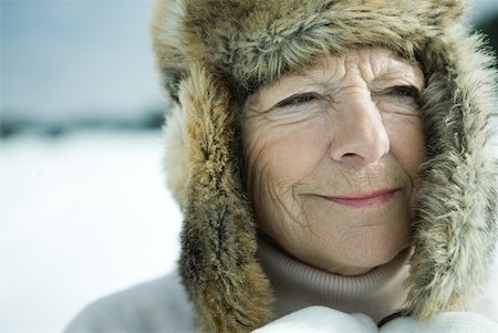 fur hat for older women - Senior woman standing in snowy landscape, head and shoulders Stock Photo - Premium Royalty-Free, Code: 633-01713753