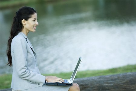 simsearch:633-01713826,k - Woman using laZSop, lake in background Stock Photo - Premium Royalty-Free, Code: 633-01713939