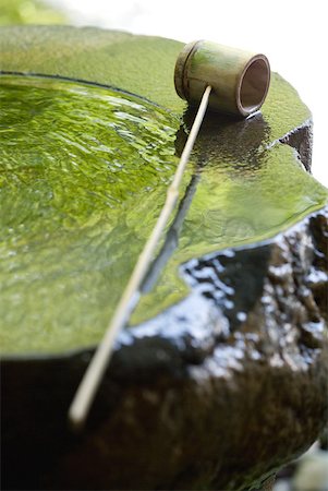 Bamboo ladle on water fountain, close-up Stock Photo - Premium Royalty-Free, Code: 633-01992850