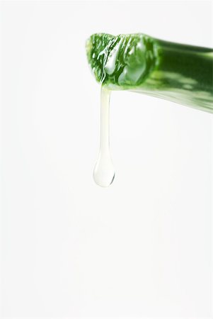 Dripping aloe vera leaf, close-up Stock Photo - Premium Royalty-Free, Code: 633-01992878