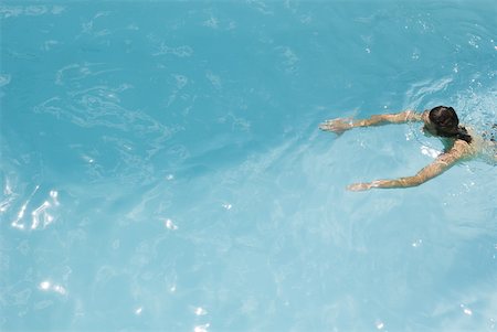 simsearch:632-03193618,k - Man swimming in pool, high angle view Stock Photo - Premium Royalty-Free, Code: 633-01992922