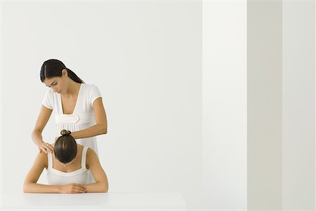 pic of person head down arms crossed - Massage therapist massaging woman's back Stock Photo - Premium Royalty-Free, Code: 633-02044579