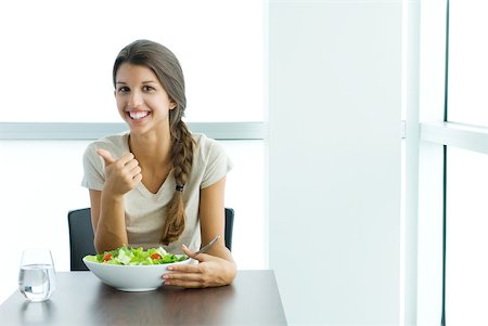 skinny teen girl - Teenage girl sitting with salad, making thumbs up gesture, smiling at camera Stock Photo - Premium Royalty-Free, Code: 633-02065910