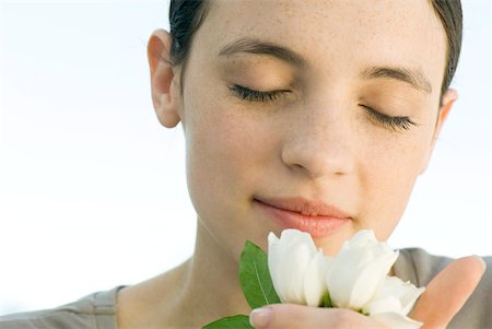 face with rose - Young woman smelling white rosebuds Stock Photo - Premium Royalty-Free, Code: 633-02128735
