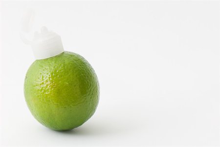 Lime with a plastic nozzle on one end Stock Photo - Premium Royalty-Free, Code: 633-02231651