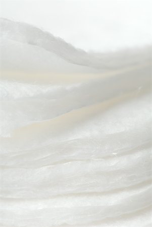 Stacked cotton cosmetic pads, extreme close-up Stock Photo - Premium Royalty-Free, Code: 633-02231817