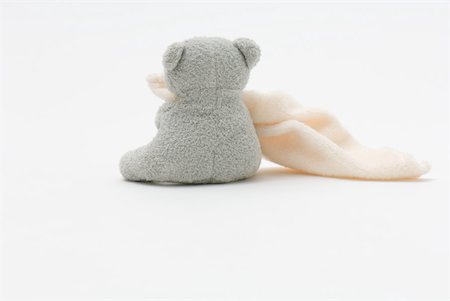 sad child sitting - Teddy bear holding blanket, rear view Stock Photo - Premium Royalty-Free, Code: 633-02345814