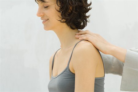 simsearch:649-07520540,k - Woman receiving lower neck massage Stock Photo - Premium Royalty-Free, Code: 633-02345918