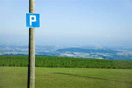 swiss panorama - Road sign of the letter "p", countryside in background Stock Photo - Premium Royalty-Free, Code: 633-02417619