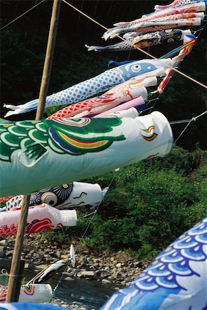 Japanese koinobori flying in the breeze Fotografie stock - Premium Royalty-Free, Codice: 633-02645328