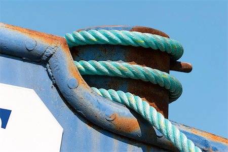 rope coil - Rope coiled around boat rigging, extreme close-up Stock Photo - Premium Royalty-Free, Code: 633-02645515