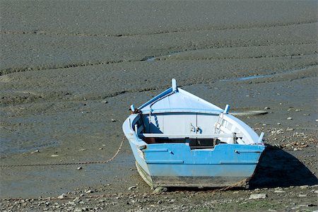 Ruderboot auf Mud Flat gestrandet Stockbilder - Premium RF Lizenzfrei, Bildnummer: 633-02645510